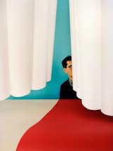 NY-based photographer Lee Towndrow shot artist and musician Steve Kado hiding behind a white, scalloped curtain. Via Lee Towndrow. (Pin)