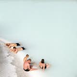 Whilst on his honeymoon vacation, photographer Peter Baker decidedly snapped this photo of visitors relaxing at the famous Blue Lagoon geothermal spa in Iceland. Via Peter Baker. (Pin)