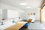 Looking Inward-Swiss architect Roger Kurath of Design*21 tackled this prefab home in Marina del Ray, California for a pair of retiring Angelenos. A handful of modernist classics—an Eames Lounge, a Bubble Lamp by George Nelson, and a shell armchair from Modernica—kit out the living room and kitchen. Photo by: Jessica Haye and Clark Hsiao