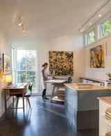 Jane Wright, a painter and printmaker, uses one end of the building as a studio. The space served as a lanuching pad for her new interior design business, Roost Modern.  Photo 3 of 5 in Homes Featuring Art Studios by William Harrison from A Modern Live-Work Studio in Rhode Island