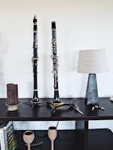 Living Room, Storage, Bookcase, Shelves, Lamps, and Table Lighting His Buffet Crampon clarinets sit on a set of Jesper Expando 230 shelving units in the great room.  Photo 2 of 8 in Grandson of Frank Lloyd Wright Constructs Peaceful Prefab Near the Legend's Famed School