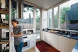 “My favorite spot is the kitchen,” says Kaja Taft of the prefab home she shares with her family in Portland. “I can stand in it and cook and converse with everyone.” The space overlooks the back yard. The white-oak cabinetry is by HOMB and the countertops are Caesarstone. A hood by Faber is above a Dacor range.