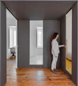 The sliding door opens to reveal a square hallway. “It’s a dark box that on the one hand opens up to the light and sound coming from the street and on the other hand protects the bedrooms from all the agitation,” Rocha says. Additional sliding doors lead to the master bedroom and bathroom.