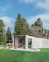 The Sonoma County home of Lars Richardson and Laila Carlsen is the result of a long-running collaboration with architect Casper Mork-Ulnes. A 713-square-foot indoor-outdoor Shotcrete dining pavilion dubbed the Amoeba provides a loose counterpoint to the more rigid barn structure behind it.