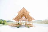The large open-air pavilion, also overlooking the lake, echoes the retreat’s timber construction and natural hues. It hosted the architect’s wedding ceremony in the year of its completion, 2014.