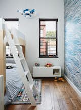 Magid selected lively Whitby wallpaper by Mini Moderns for Linus’s room, along with Oeuf’s Perch bunk bed. The homeowner found the light-up rocket-ship mobile on a trip to Mexico City.