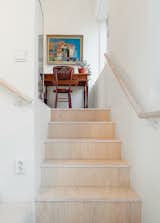 The flooring and stair risers are European ash, treated with a varnish that was tinted one percent white.