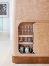 Storage Room and Cabinet Storage Type Salminen chose flame birch for the cabinetry for its remarkable wavy wood grain.  Photo 6 of 12 in This Cozy Finnish Home Would Not Be Complete Without a Sauna
