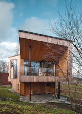 Exterior, Wood Siding Material, and House Building Type The exterior is clad in Siberian larch, which doesn’t require paint and will develop a gray patina.  Search “modern studio finnish design legend” from This Cozy Finnish Home Would Not Be Complete Without a Sauna