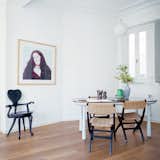 The best way to integrate different furniture styles is to treat “the space like a gallery and place objects according to their colors,” internationally acclaimed designer Jaime Hayon says. He cautions against using too much natural wood furniture in a space with wood floors: “You need contrast.” In his newly renovated home in Valencia, Spain, contrasting materials, small porcelain objects, and an occasional black form enliven a palette of light gray furniture. Photo by: Nienke Klunder