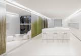 NArchitekTURA chose a monochromatic white interior for its "Apartment of the Future—R&D Laboratory" in Dobrodzień, Poland, taking a cue from the design of contemporary cellphones and other mobile devices.