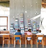 Homework at the kitchen table goes modern in the Bishop house. Check out the entire slideshow to see the home's creative use of reclaimed timber and angular geometries. (Pin)
