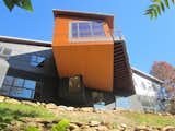 A dramatic cantilever forms the home's communal living space.  Photo 15 of 23 in 10 Gravity-Defying Cantilevered Homes from A Contemporary North Carolina Home Navigates a Tricky Site Atop a Ridge