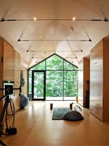 The client, a life-long practitioner of yoga, was tired of the drab, enclosed yoga studios he usually used. Instead, he desired a beautiful space that connected to the outdoors. Thanks to its views and simple interior finish, the client described it as supremely tranquil and a warm ‘womb-like’ environment.