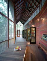 This Texan abode is made up of two-by-four cedar strips. A frieze of screened openings runs the length of the building, allowing a cross-breeze and extra light in, while ceiling fans keep the air circulating in summer. “Animals, from deer to raccoons to all kinds of birds, come right up to the porch,” says Panton. Photo by: Greg Hursley