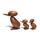 The Duck + Duckling Series is a playful celebration inspired by true events. In 1959, a Danish police officer stopped traffic in order to let a young family of ducks across the road. Inspired by the newspaper photographs, Hans Bølling designed the duck and duckling figures to playfully commemorate the event. Now icons of Danish design, the figurines are handcrafted from teak and feature smooth, rounded forms and exaggerated beaks.