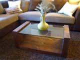 Glass-topped dark walnut coffee table by Dolenz and Daughters.