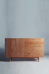 Inspired by Scandinavian simplicity, the Rex sideboard is handcrafted by Coil and Drift in Brooklyn from cherry wood. It features slender brass pulls and soft-close hinges. The pull down door opens to reveal a mirrored niche—perfect for your at-home bar.  Search “cascade coil drapery” from Case Closed: 7 Casegoods to Streamline At-Home Storage