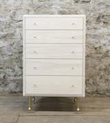 Turned-brass feet and drawer pulls meet with bleached, solid ash wood in the Pacific dresser by Volk Furniture.