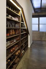 A custom shoe closet displays the couple's large footwear collection.