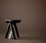 Side table by Karakter, Hall 15 Stand C32, at Rho.