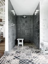 As a traditional flooring, cement tiles originated over 150 years ago, but are seeing a newfound appreciation. Shown here is Paola Navone's shower in her renovated industrial-style home in Italy. The floor is lined with custom Carocim tile from Morocco.