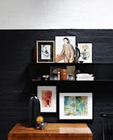 In collaboration with Wolfram Neugebauer, von der Hude shot various paintings and illustrations against a partially painted black brick wall.