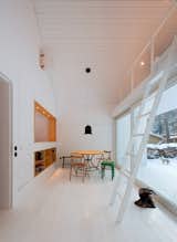 During snowy winters, the white interiors seamlessly blend with the home’s exterior. Berlin, Germany. By Atelier st Gesellschaft von Architekten mbH from the book Rock the Shack, Copyright Gestalten 2013.