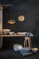 Based in Swaziland, Quazi Design started as a jewelry maker in 2009, and now produces home accessories and furniture. Whether bowls, pendants, or pillows, all of the studio's designs are made out of paper.