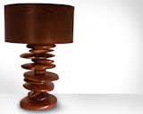 The hand carved walnut "rocks" that form the base of this Rock Pile lamp are stacked and spin independently of one another, allowing the pile to change shape. “In contrast to the pixel style of design I often incorporate into pieces, these rocks are my way of being more freeform and not so meticulous,” says Michael Rupich.