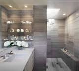The master bathroom is lined with Grey Haisa stone tiles.