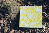 A bright yellow and gray textile tile by Jordaan.