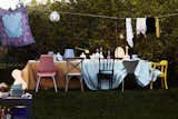 A product shoot that resembles a garden party featuring interesting chairs and accessories.