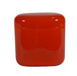 A curvy storage jar designed by Angeletti Ruzza and coffee producer Lavazza is comfortable to hold and easy to open. The glossy red acrylic has a white interior, is dishwasher safe, and provides airtight storage for coffee and tea.