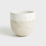 Tall Stoneware Zen Cup, $50, by Materia Lumina for Dara Artisans

This piece comes in right at $50: Handmade by Belgian native Eefje Theeuws in her Joshua Tree, California, studio, the Zen cup is part of a larger line of stoneware crafted to show every nuance of the natural material.