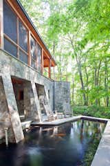 Western Maryland fieldstone outlines the patio and columns surrounding the koi pond.