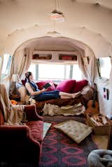 About a mile from the Pacific Ocean on a tropical fruit farm lies Julie Montgomery's (seen here) renovated Airstream home which she shares with her son, Henry. Via Apartment Therapy.