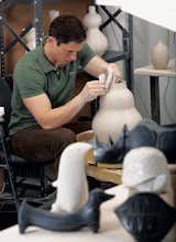 Seventeen years ago, Jonathan Adler wasn’t a brand, he was a one-man full-time pottery production operation—“making, glazing, firing, packing, and shipping every single piece I made.” After successfully pitching an initial order for Barneys, he expanded his empire to eponymous shops in major cities across the United States and an online catalog featuring goods that range from ceramic rhinoceros boxes to wool area rugs to lamps and candleholders.
