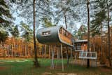 To reduce impact at the site, Baumraum prefabricated the house and craned it atop 19 steel columns, arranging it so that the surrounding trees’ roots wouldn’t be harmed. From within the structure, people experience a perspective that inspires more respect and consideration of the environment at large.