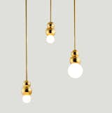 The bubbly metallic Ball Lights Gold is made up of polished brass and nickel or black plated stainless steel. Available with silk braided or gold plated pendant rod.