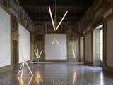 A gang of Lit Lines strategically center a Baroque style room at the Nilufar Gallery in Milan, Italy.