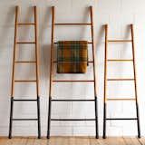 The Bloak Decorative Ladders marry the classic silhouette of a ladder with distinctive details. Available in three sizes, each ladder is made of strong oak wood that is ideal for hanging bath towels, linens, or scarves. The bottom of each ladder features a black oxidized finish, giving the ladders additional visual appeal.  Photo 18 of 19 in Laundry Room by Bartlett Creative from Made in America: Simple and Functional Products from Philadelphia