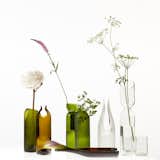 One of the most affordable ways to add character to a coffee table is with flowers. Stick with fresh-cut, all-white blooms for a sophisticated look.

Two Hole Vase, $50, available in the Dwell Store.  Photo 4 of 5 in 5 Modern Summer Home Upgrades