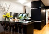 Arclinea's black cabinets with stainless-steel trim outfit the Manhattan kitchen of Dana Dramov.  Search “kitchencounters--granite” from A Modern Kitchen Renovation in New York