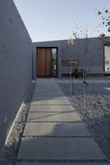 With its expansive, geometric design and wide concrete-slab walkways, the enclosed central courtyard around which the house is organized creates outdoor space protected from the sometimes-inhospitable wind out of the northeast.