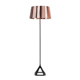 With its industrial aesthetic cast iron base, minimal metallic shade and classical proportions, the Base Lamp from Tom Dixon remains an interior design staple. Traditional matte textured cast iron makes up the robust body, supporting a spun-copper shade that has been highly polished to create a super-reflective and alluring shine.
