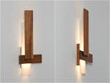 Sedo Wall Sconce. Made of brushed aluminum and walnut, the Sedo is composed of three floating planes, all kept flat against the wall. This simple composition creatively hides the light engine from view and filters the light as it’s dispensed up and down the wall.