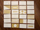The designer screen printed his own business card in 24 different designs, some of which are "basically useless as business cards." Gold on 130lb natural paper.