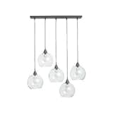 Firefly Pendant

Each iron Firefly fixture from CB2 comes with five glass shades which would look great lined up above the dining table or kitchen countertop, or illuminating the living room.  Photo 4 of 9 in Trend Spotting: Bare Bulbs by Megan Hamaker