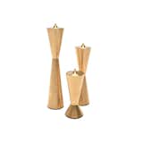 Designed by Ariane van Dievot, the Avandi Candlestix Candle Holder Set is a series of three sleek candlestick holders. Made from machined solid brass, each candle holder has a decidedly modern shape, and includes a pointed top for both securing a candlestick and stacking other holders in the series.